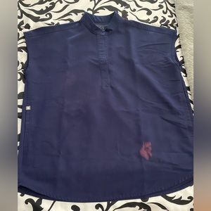 Navy Scrub top. Does have a stain at the bottom but in good condition